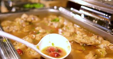 pork legs food buffet selection featuring a variety of seafood, fried food, and vegetable soup video