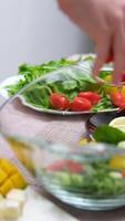 sprinkle greens salad leaves Person Cutting Tomato with Sharp Knife on a White Board to decorate Lobster dish video