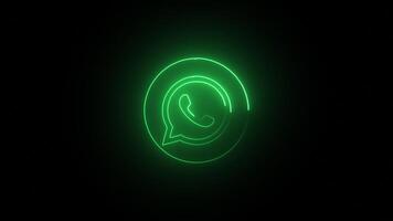 Green color glowing neon whatsapp icon, neon frame on black background. whatsapp neon lines, abstract background with animation of flight in abstract futuristic loop with neon light. video