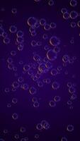 A stream of shiny bouncy bubbles flowing outwards against a purple gradient background. This simple fun vertical background is full HD and a seamless loop. video