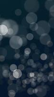 Abstract bokeh animation with gently flickering defocused bokeh light spheres. This vertical motion background is full HD and a seamless loop. video