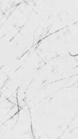 Black and white grunge texture background with distressed scratches, grainy noise and dust particles. This gritty textured vertical animation is full HD and a seamless loop. video