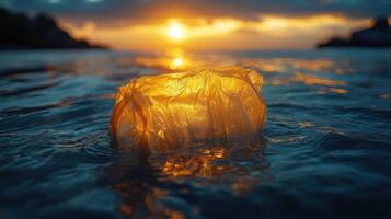 Floating plastic bag glows at sunset, illustrating pollution's impact on ocean life photo