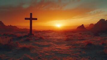 Cross standing in a vast desert landscape during a vibrant sunset with dramatic sky colors and rugged terrain photo