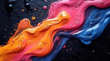 Colorful abstract paint swirl on dark surface creating vibrant texture and contrast photo