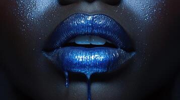 Bold blue lips create a striking visual with glitter and dripping shine in a high-fashion artistic display photo