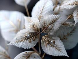 Delicate white leaves intricately detailed with gold veins and clusters of small white and gold spheres create a luxurious, artistic design with a metallic and elegant appearance photo