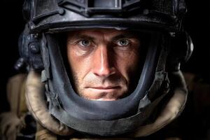 Intense gaze of a man wearing a helmet with a serious expression. The lighting highlights facial features, and the helmet's intricate details add depth. No text present photo