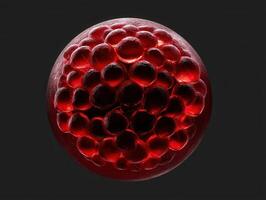 Red spherical object with a smooth texture, composed of multiple reflective bubble-like structures clustered together, creating a vivid illuminated pattern against a dark backdrop photo