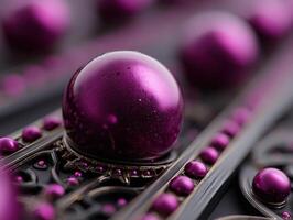 Shiny purple spheres with metallic reflections and intricate decorative patterns. The main sphere is in focus, while the background features more soft-focused spheres. No text visible photo