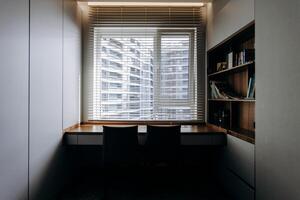 A minimalistic workspace featuring a stunning modern window view that enhances productivity photo