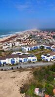 Drone View of Colorful Coastal Town with Pools and Beach video