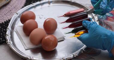 Easter eggs and coloring egg activity with vibrant paints in a festive atmosphere photo