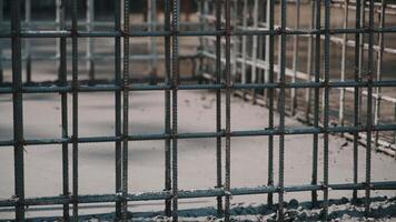 steel reinforcement structure forms framework of future building. Metal rods video