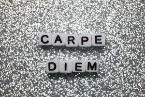 Inspiring message displayed with letter blocks on a shimmering background photo