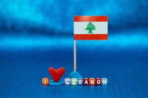 Handmade heart and flag display showcasing love for Lebanon with colorful blocks on a blue background photo