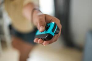 Hands using game controller. Playing games close-up photo