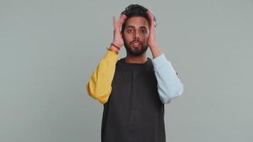 Annoyed irritated handsome man covering ears gesturing No avoiding advice ignoring noise loud voices video
