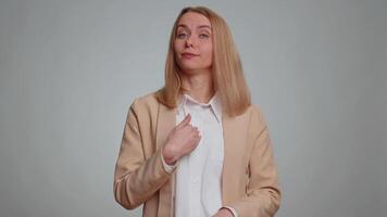Confused irritated businesswoman pointing fingers herself, rejection, refusal, stop, shock sign video