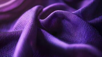 Purple fabric with a shiny texture. It is a close up of the fabric photo