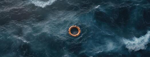 An aerial view of a life ring floating in the ocean photo