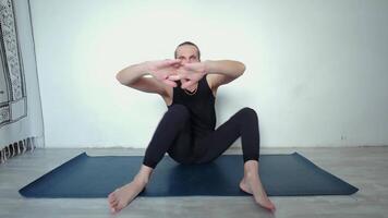 man is doing a yoga pose on mat video
