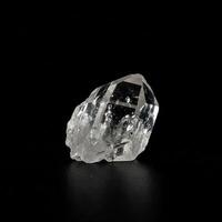 A large crystal on a black background photo