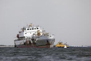 Abandoned ship in a harbour photo