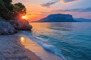 Sun Shining through Trees at Sunset on a Rocky Beach in Croatia photo