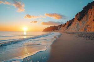 Golden sunset illuminating sandy beach and white cliffs photo