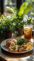 Delicious brunch with iced tea near a window with plants photo