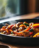 Steaming chicken fajitas with bell peppers in a cast iron skillet photo