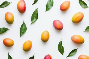 mango fruit on white background with green leaves photo