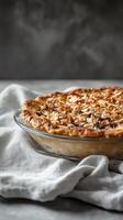 A pie with a crust on top on a table photo