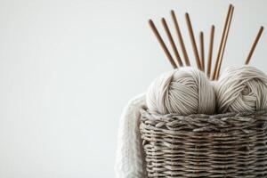 A basket with yarn and knitting needles photo