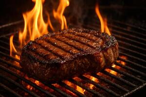 A steak is cooking on a grill with flames photo
