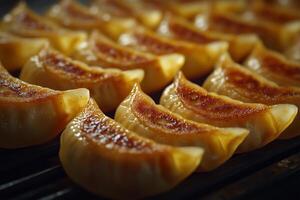 A close up of a bunch of dumplings on a grill photo