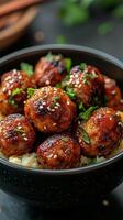 Chicken meatballs with rice and sesame seeds photo