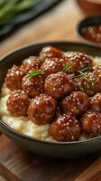 Chicken meatballs with sesame seeds on mashed potatoes photo