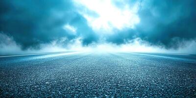 An empty road with a dark sky and clouds photo