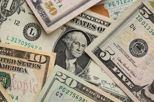 Stack of dollar bills. Hundred, fifty, twenty, ten, five dollars banknote close up photo
