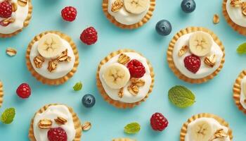 Cracker biscuit with oats, banana slice, raspberry and blueberry fruit pattern blue background photo