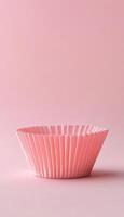 Empty paper cup cake preparing for baking snack dessert on pink background photo
