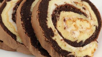 A chocolate and white swirl cake on a plate video