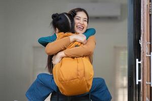Back-to-School Excitement and Connection. A joyful reunion between a woman and a girl, symbolizing the start of a new school year. photo