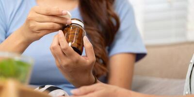 Wellness and Supplements. A mother discusses vitamins with her child, fostering an interest in health and well-being. photo
