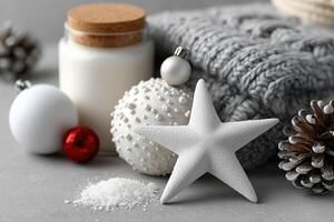Holiday decorations featuring a starfish, candles, and festive ornaments on a cozy knitted background photo