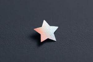 Shimmering star decoration on dark surface highlighting its reflective nature photo