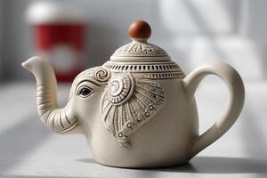 Elephant-shaped teapot rests on a table with soft light illuminating the ceramic design photo