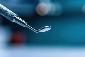 Dental tool used for examination and cleaning in a modern dental office setting photo